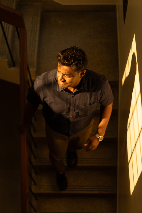 A person at Pāri Washington's office stairwell